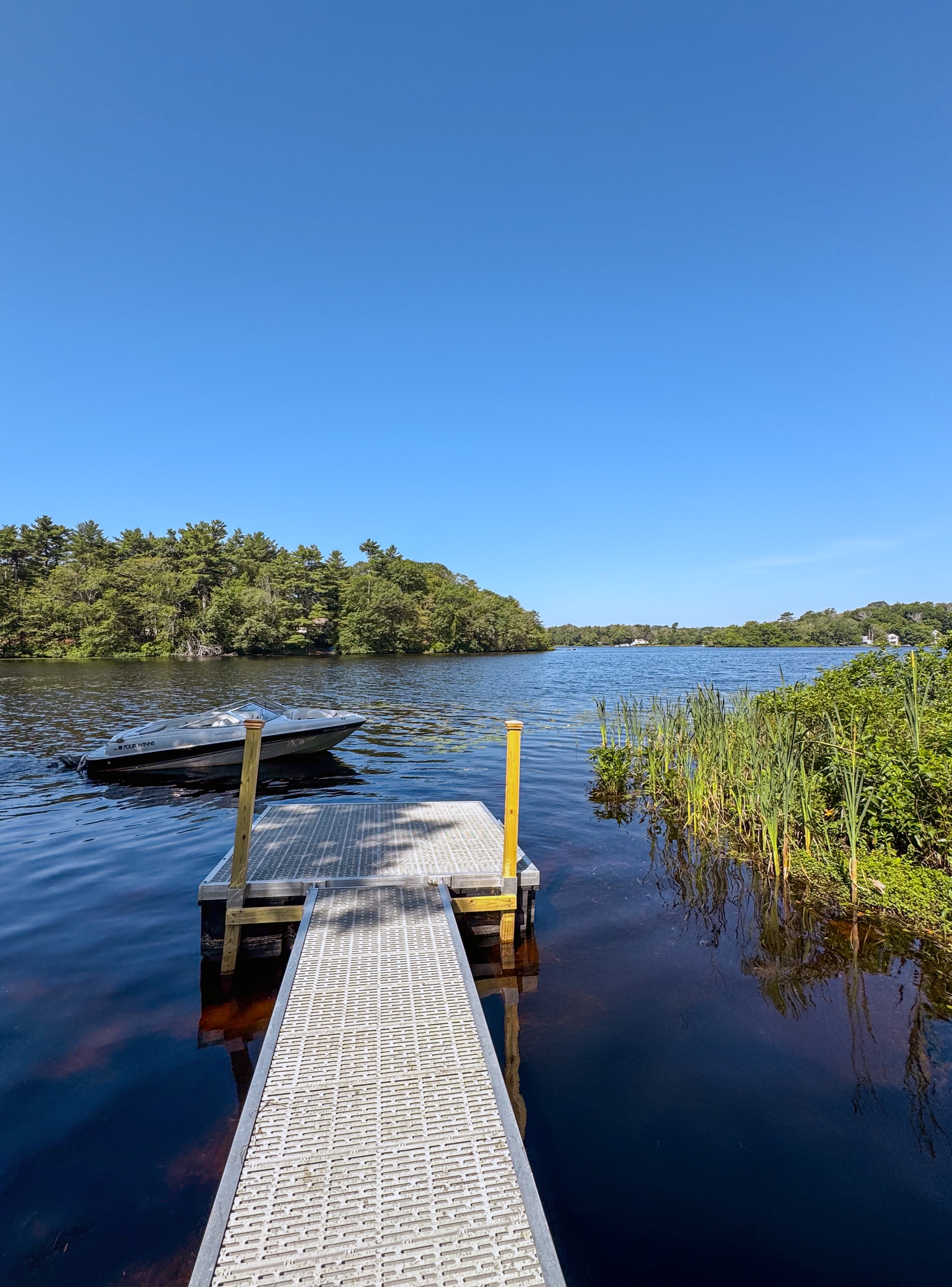 The private dock at The Lakehouse Bungalow on Chebacco Lake